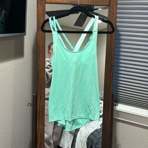 Women’s size Medium cross strap Under Armour tank top